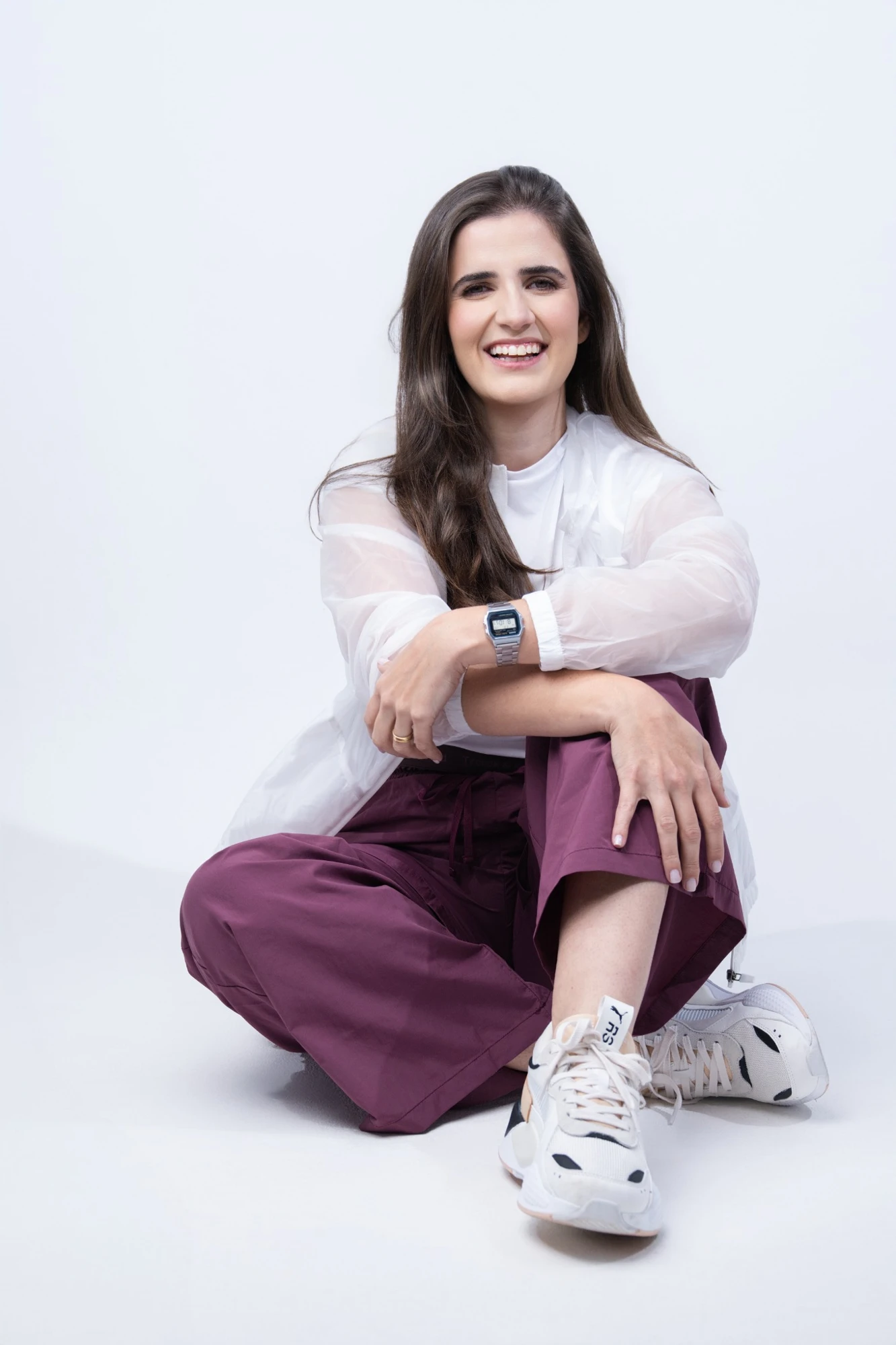 Mayse Resende sentada em roupa de treinamento